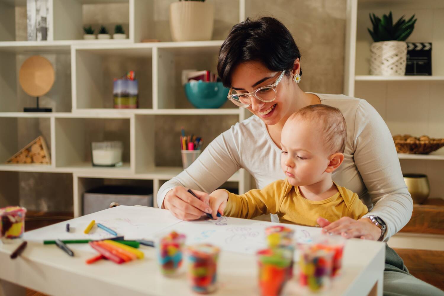 Mother coloring with her toddler