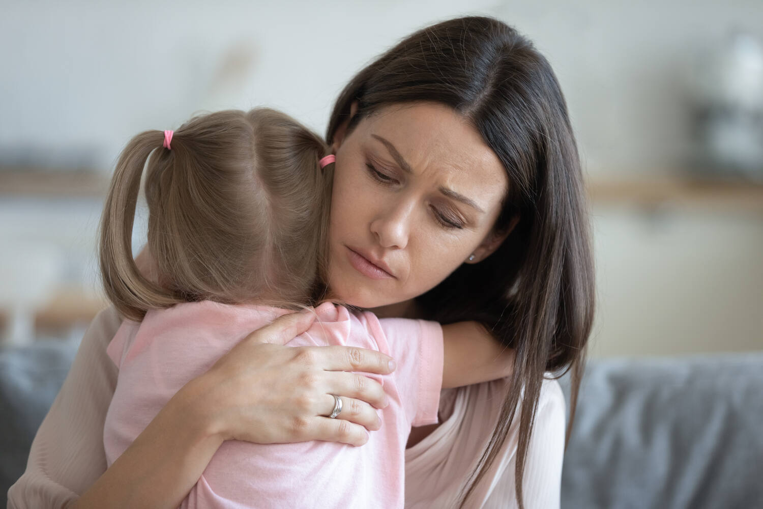 A mother comforting her toddler