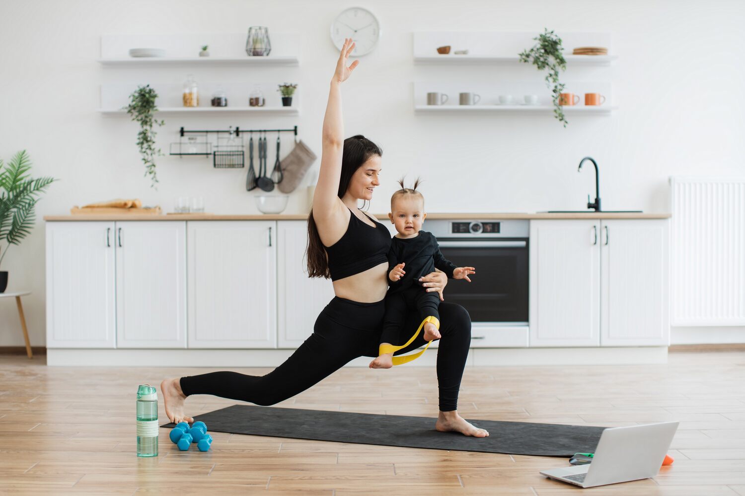 Mom doing lunges with baby