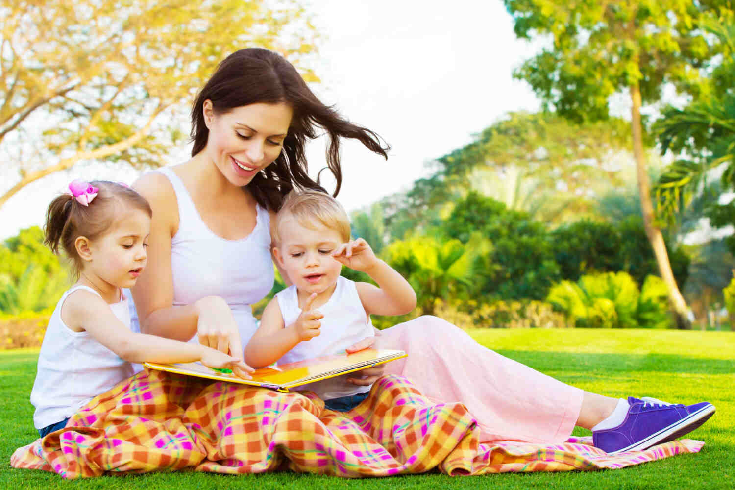 A mother with her toddler and baby