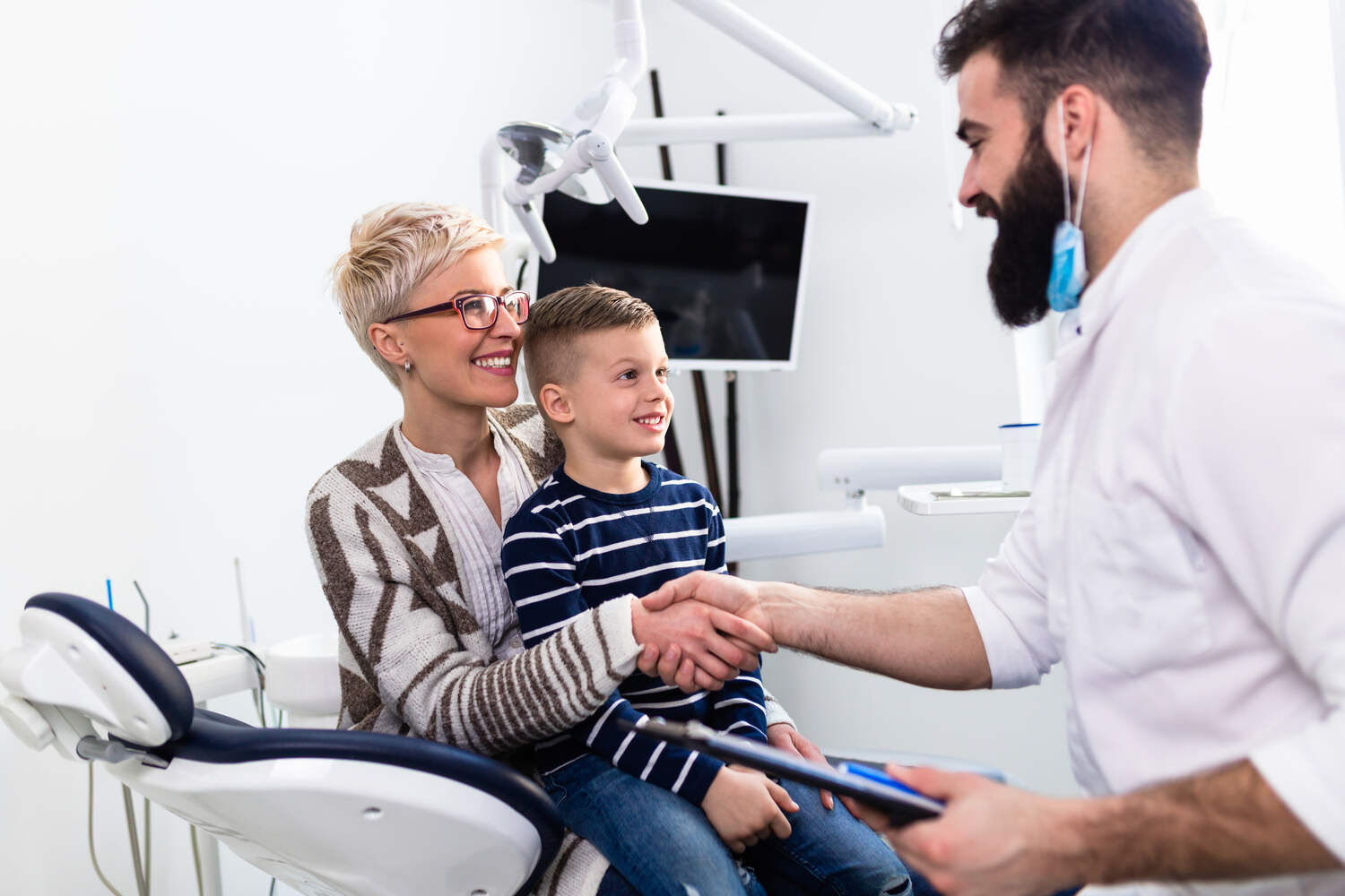 A parent and a child at dentist office