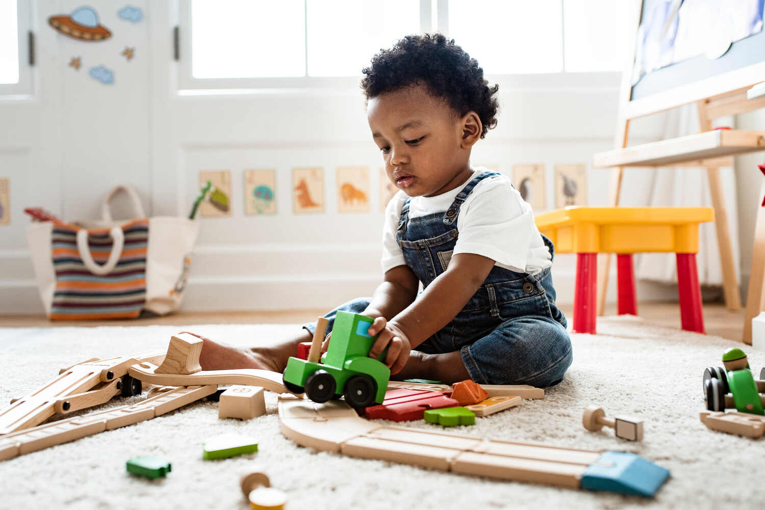 A toddler boy playing 