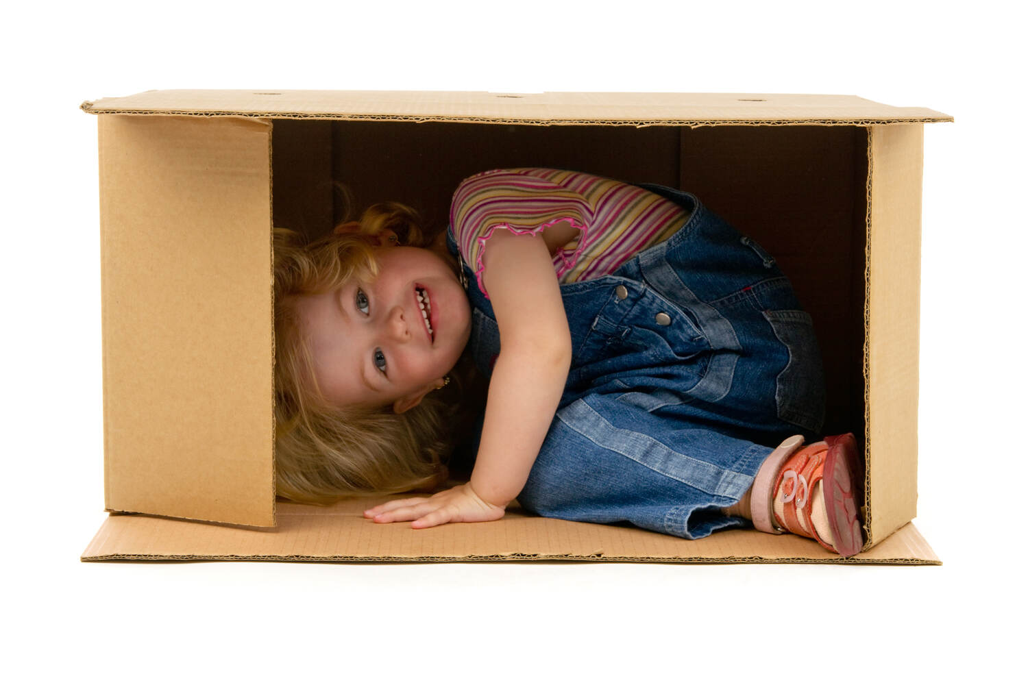 toddler inside a cardboard box