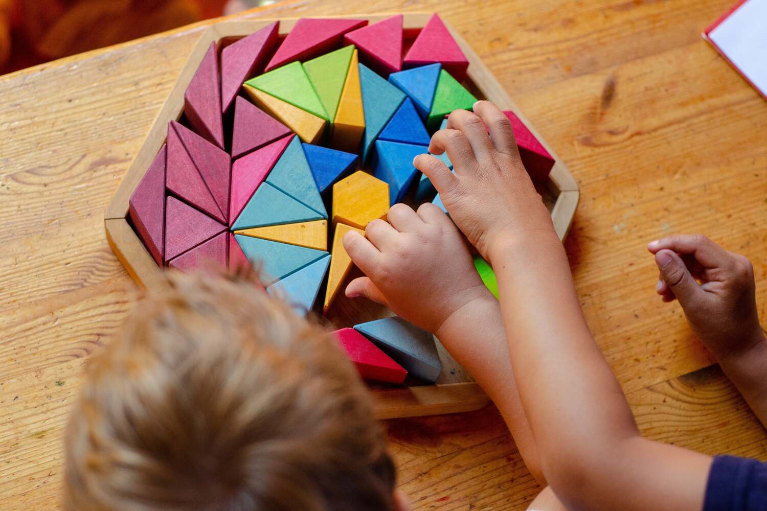 A toddler playing with blocks