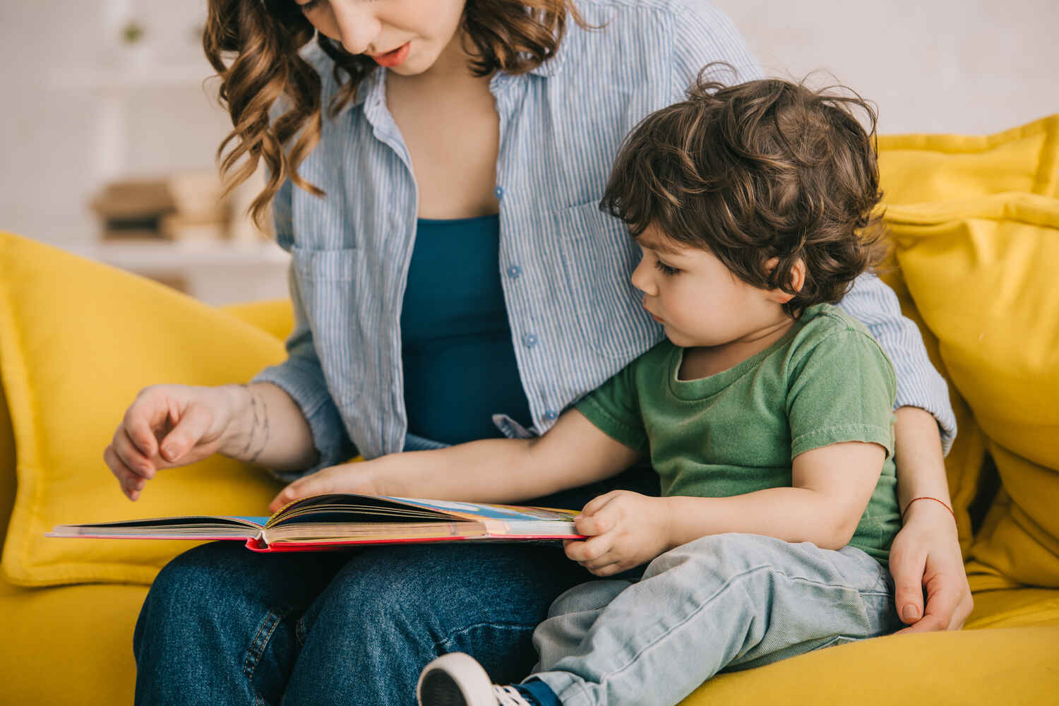 A toddler and mother reading