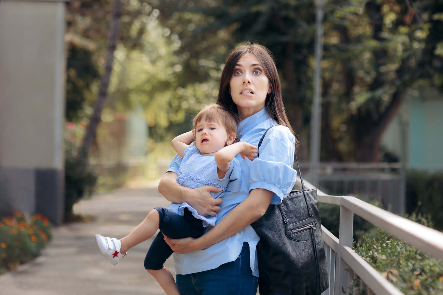 A mother with her toddler in public park