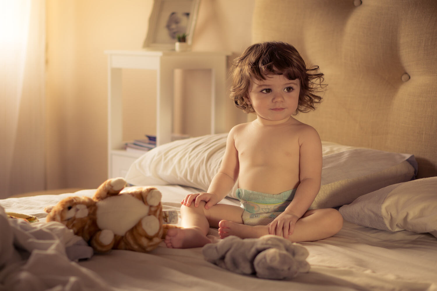 A toddler girl sitting 